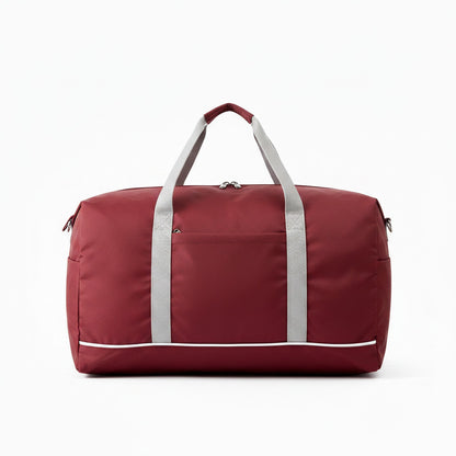 Sac de voyage MoveLite bordeaux en tissu résistant avec anses grises et fermeture éclair, idéal pour le sport