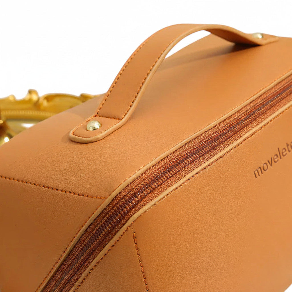 Trousse de voyage MoveLite couleur camel avec poignée et fermeture éclair dorée
